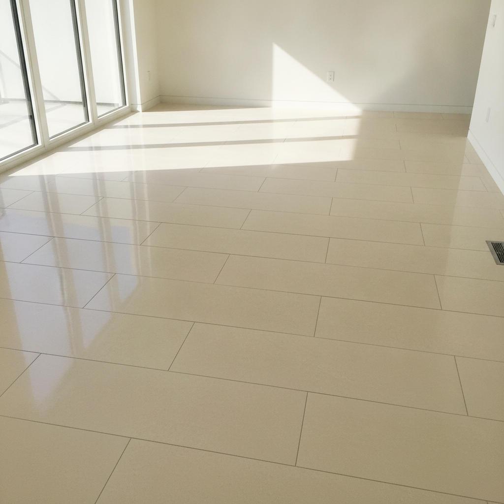 Newly installed large-format light porcelain tile floor